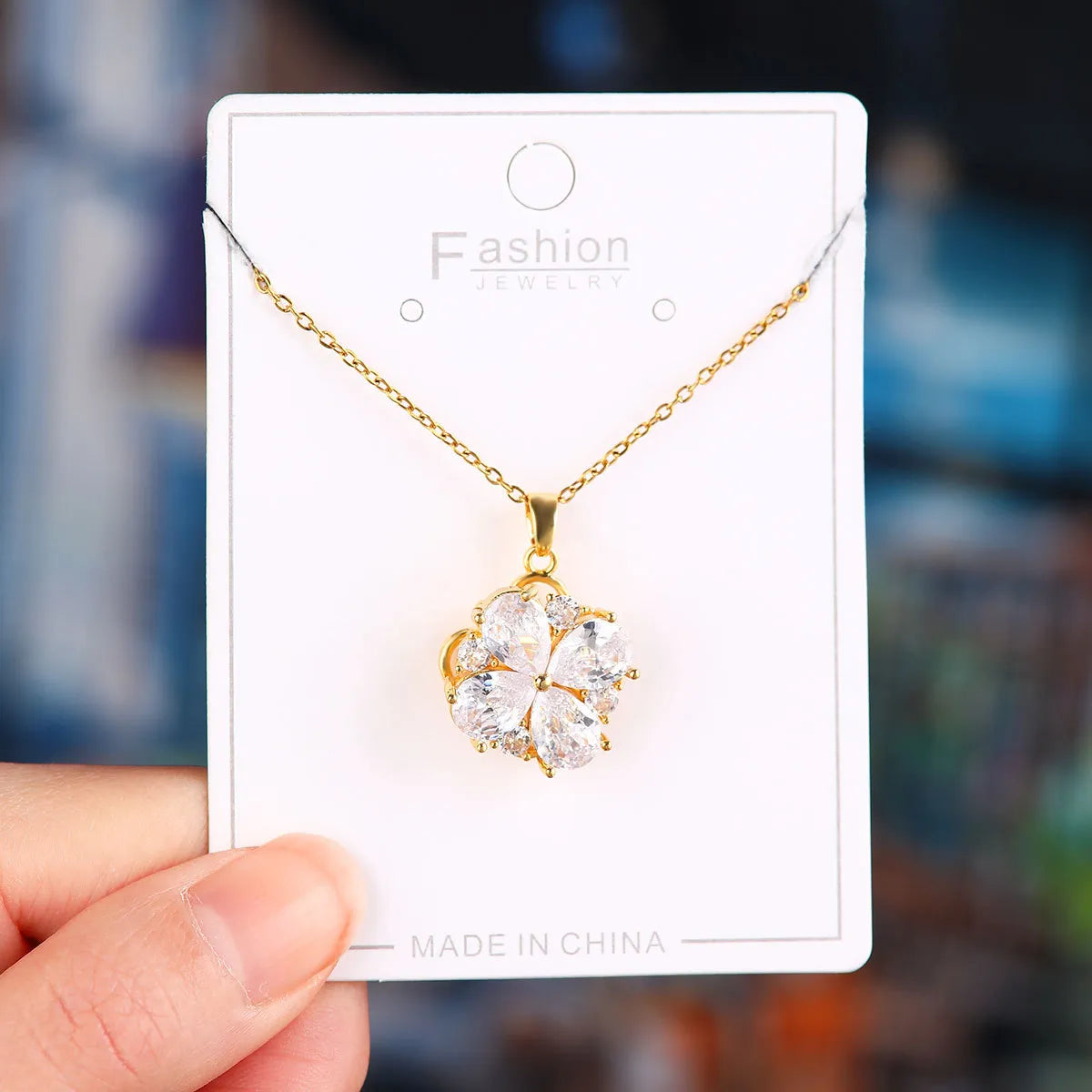 X5778# Golden Rotating White Zirconium Four-Petal Flower